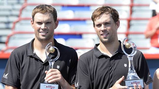 Aug 16, 2015; Montreal, Quebec, Canada; Bob Bryan (L) and Mike Bryan (R) with their champions trophies during the Rogers Cup tennis tournament at Uniprix Stadium. Mandatory Credit: Eric Bolte-USA TODAY Sports